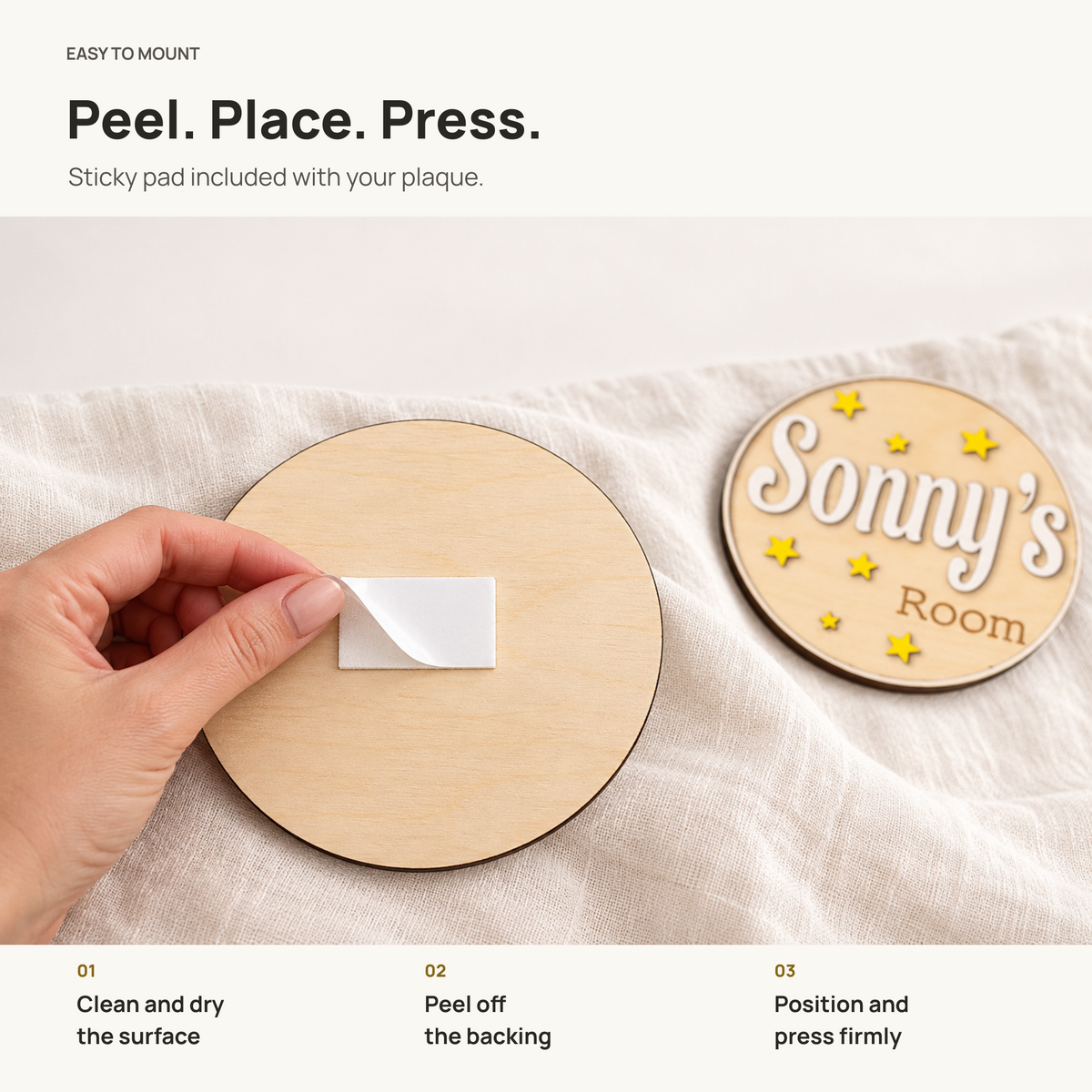 Sticky pad included with the personalised wooden plaque, showing how to peel, position and press