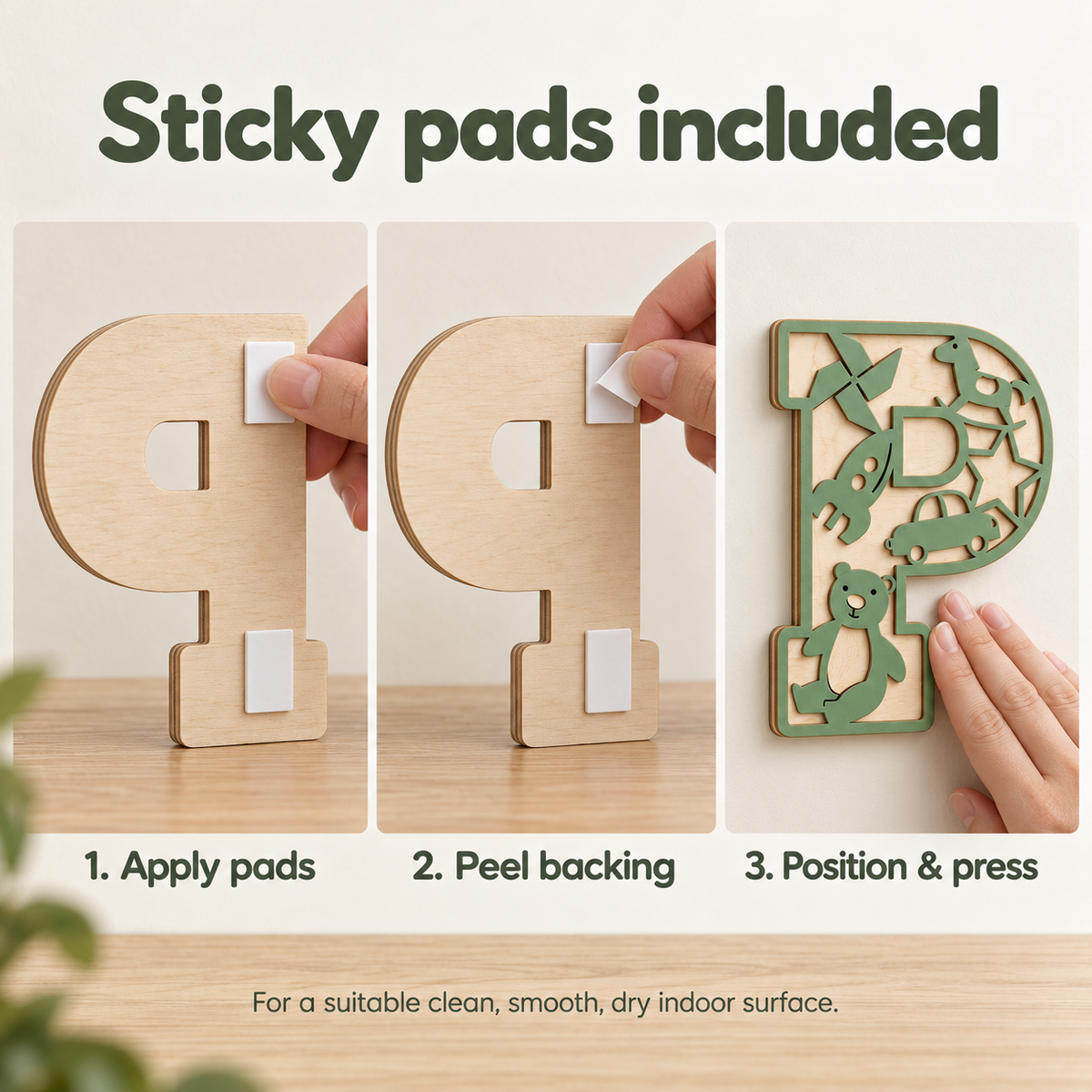 Three-step mounting guide showing sticky pads applied to the natural wooden back, peeling the liner and pressing the letter onto a wall
