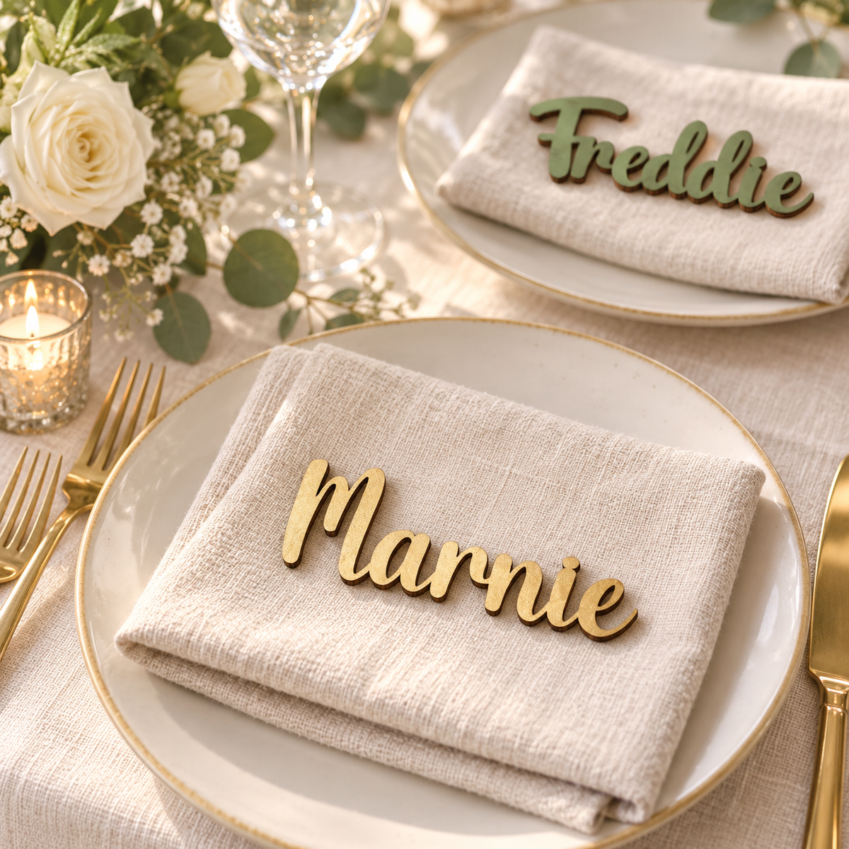 Gold Marnie and Sage Green Freddie wooden name place cards on cream linen wedding place settings